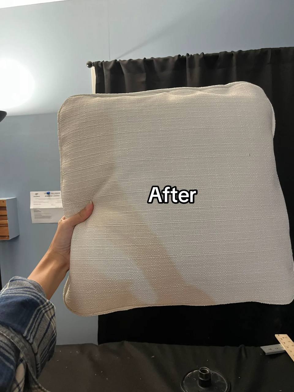 Sofa cushion reupholstered in a clean, modern off-white fabric.