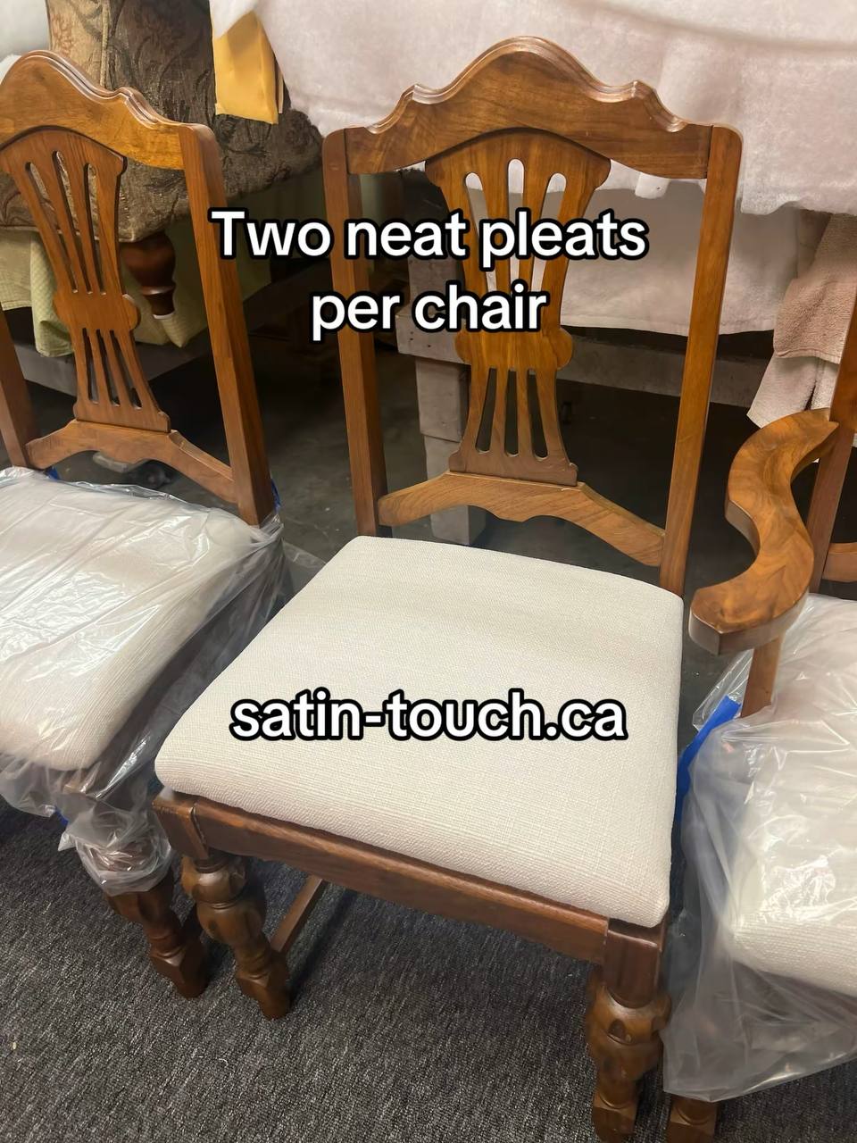 3 wooden dining chairs with a medium to dark-toned hardwood frame, featuring turned legs and a vertical slat backrest with a curved top rail, upholstered in white-colored fabric