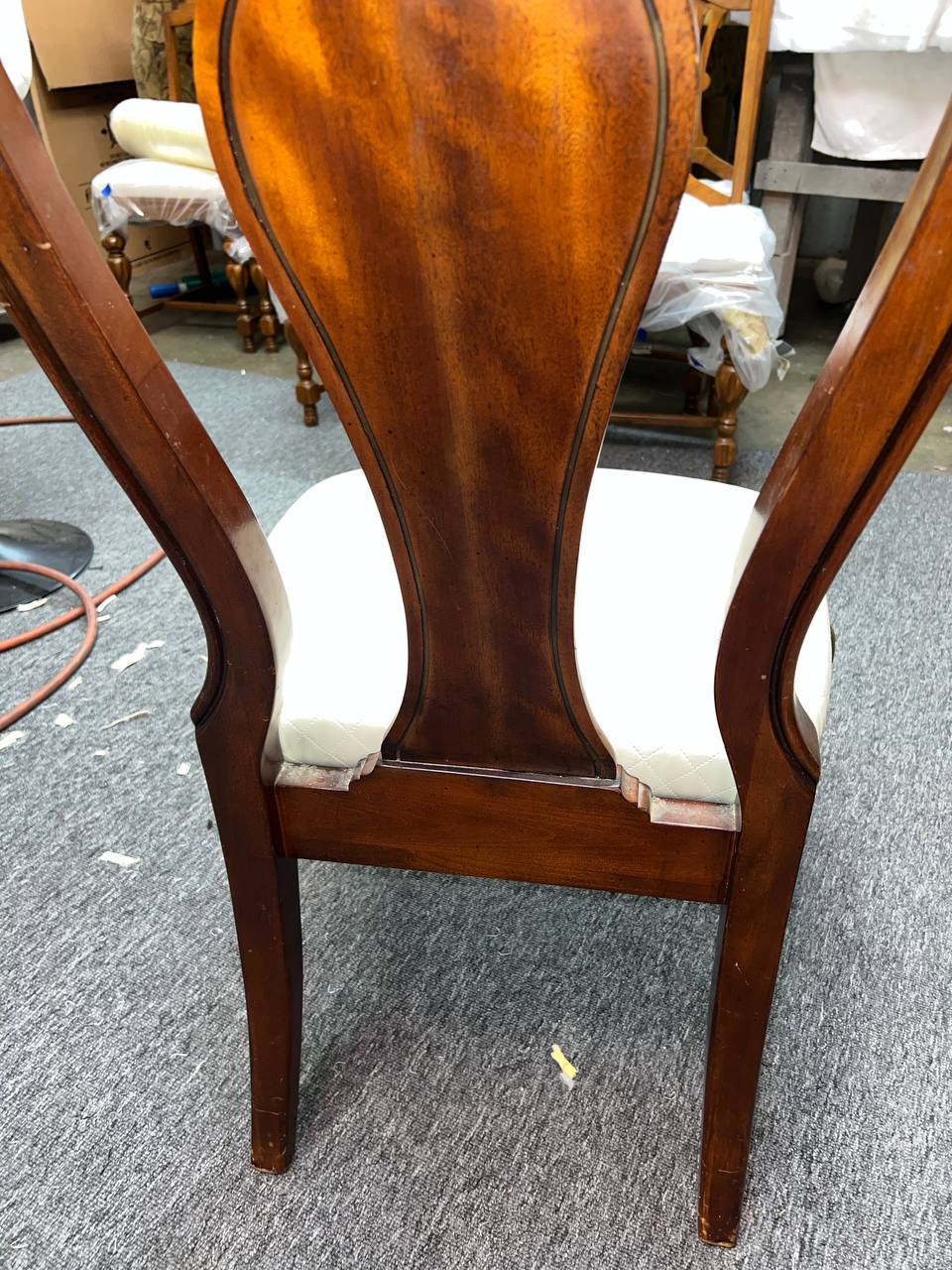 Wooden dining chair with cream tufted cushion and cabriole legs