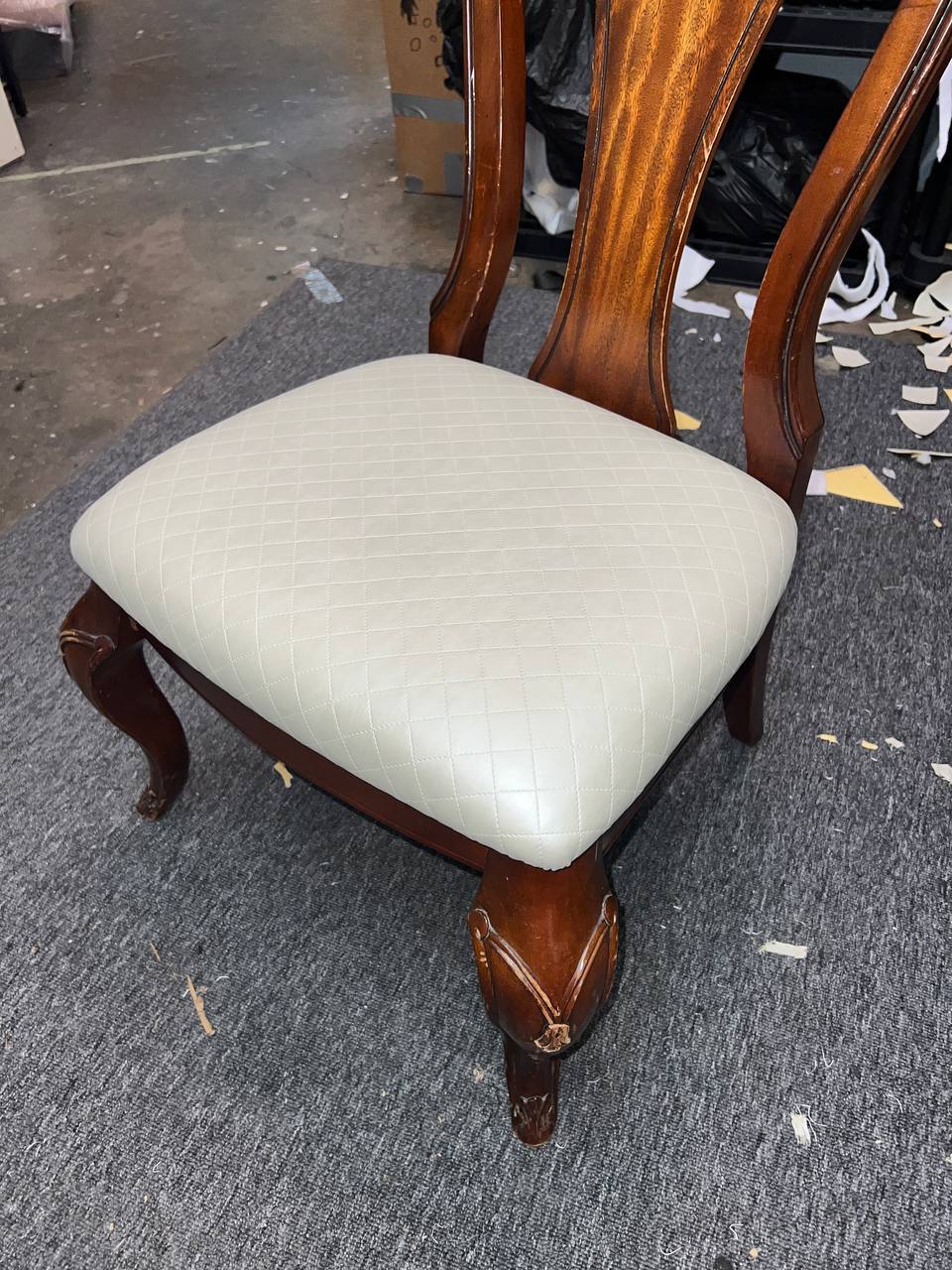 Wooden dining chair with cream tufted cushion and cabriole legs