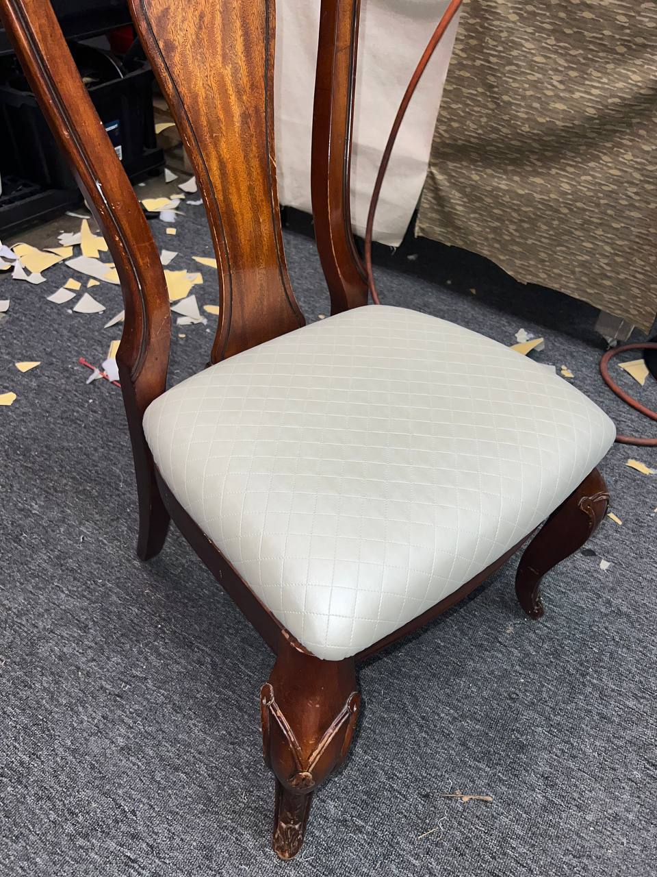 Wooden dining chair with cream tufted cushion and cabriole legs