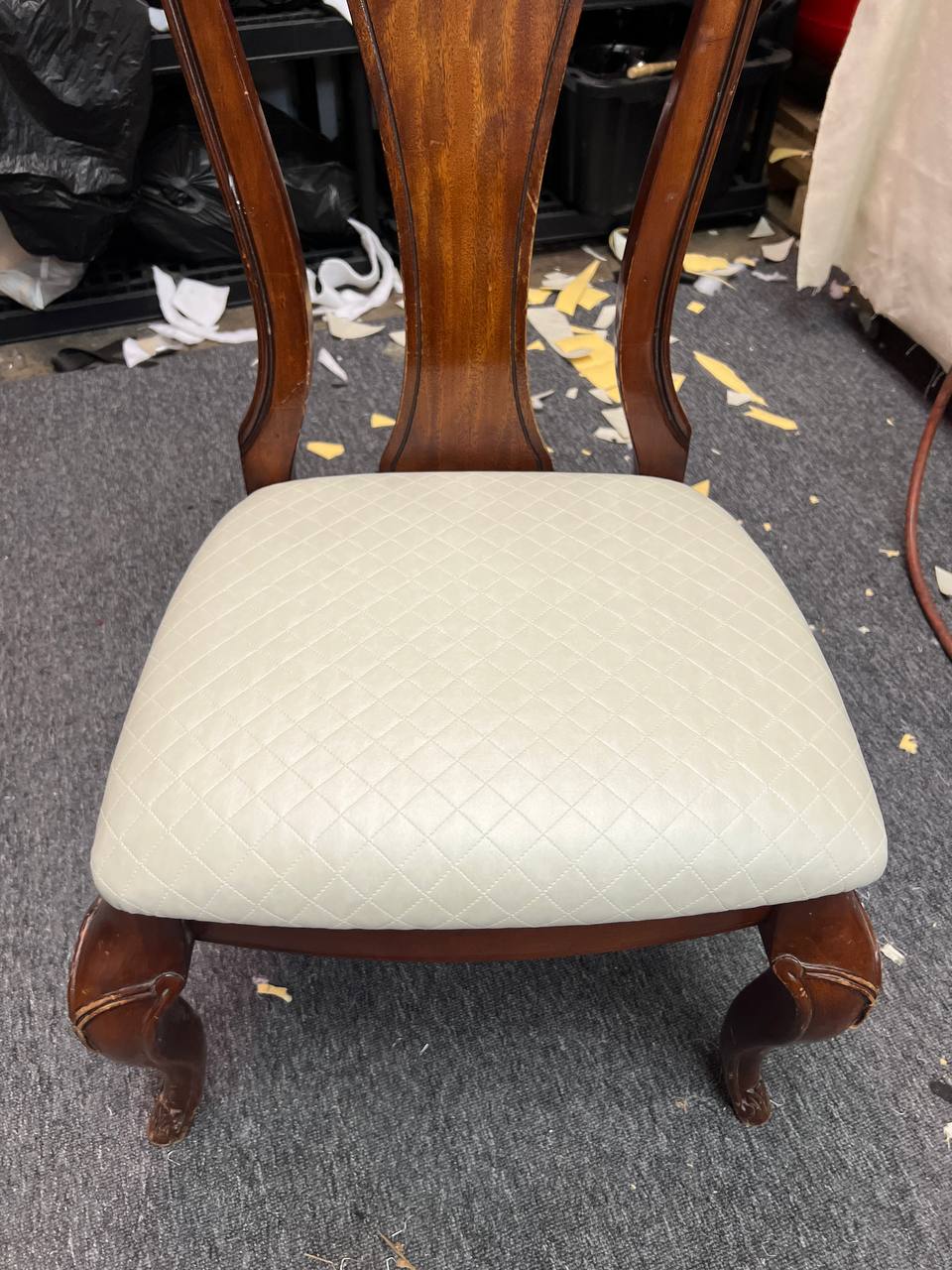 Wooden dining chair with cream tufted cushion and cabriole legs