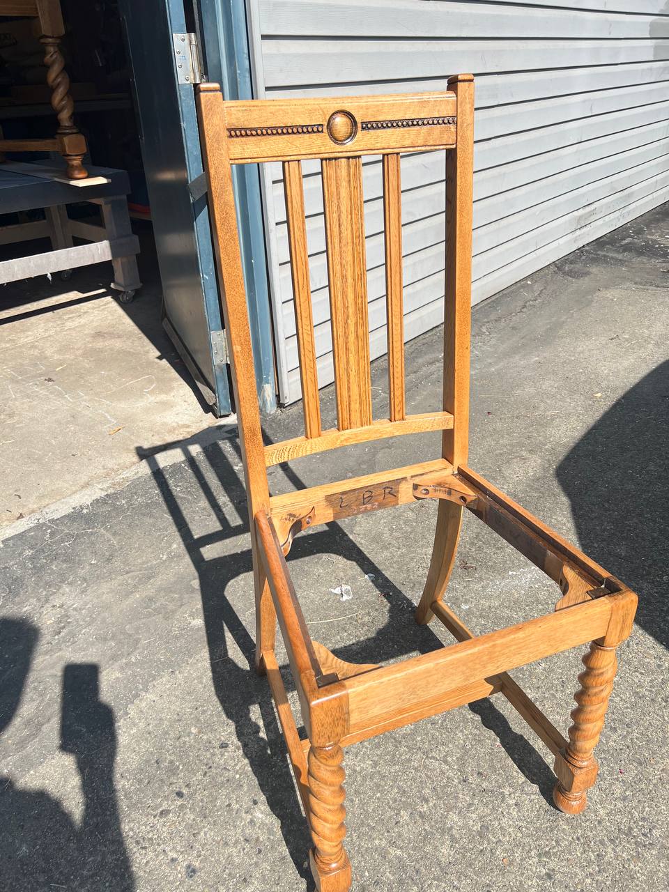 Frame of a wooden dining chair without the seat cushion
