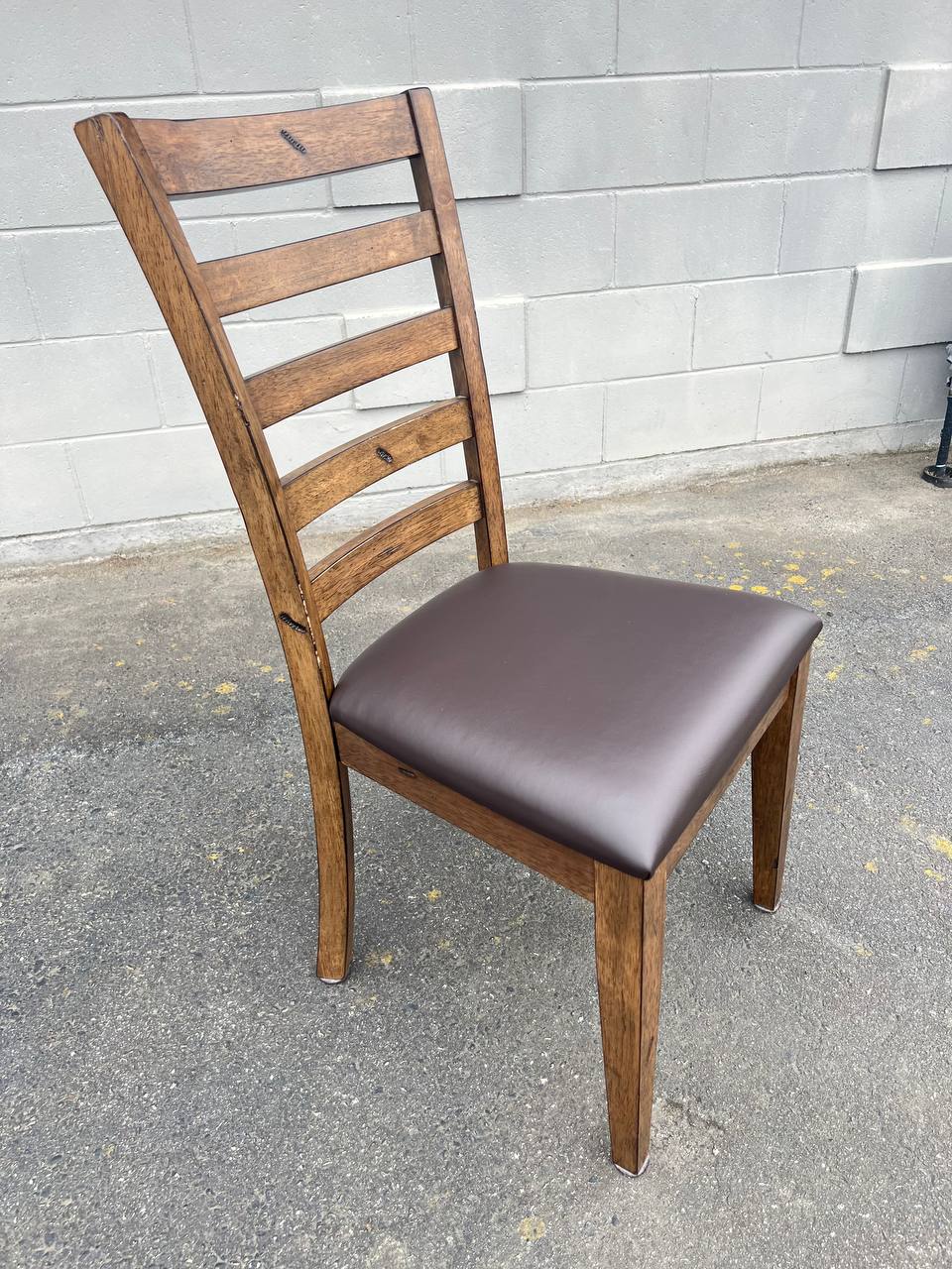 Brown wooden ladder-back chair