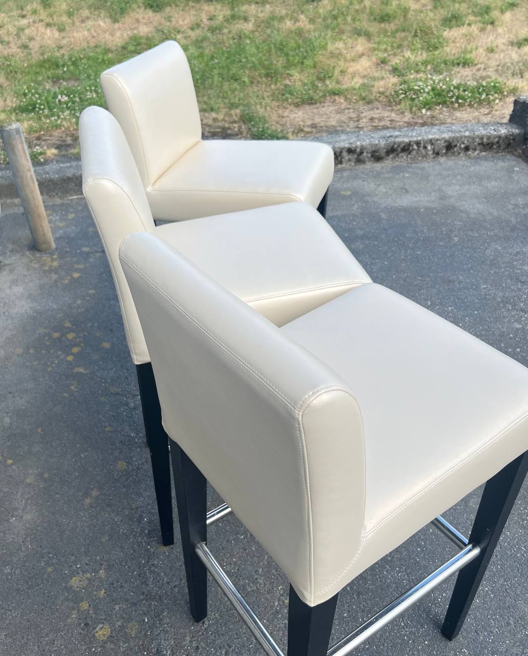 3 Cream colored vinyl barstools