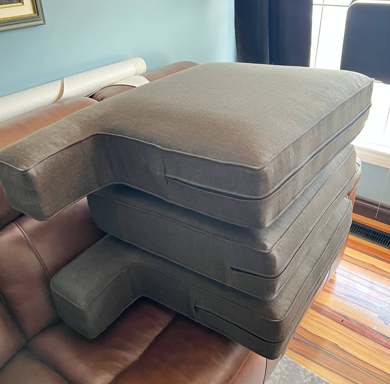 three six inch thick sofa cushions that have had new foam placed inside