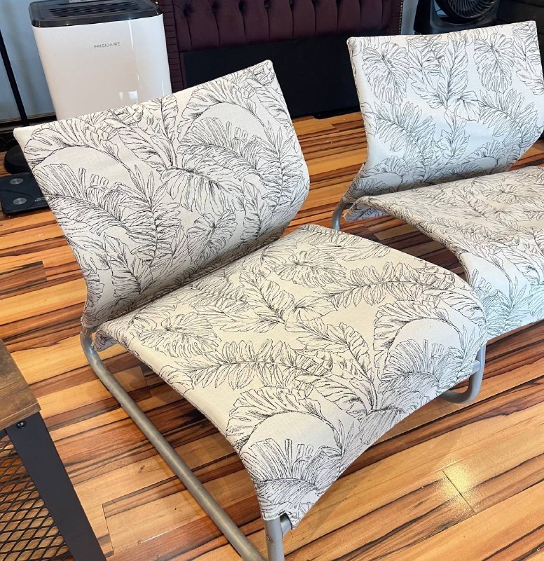 2 patio lounge chairs with floral pattern