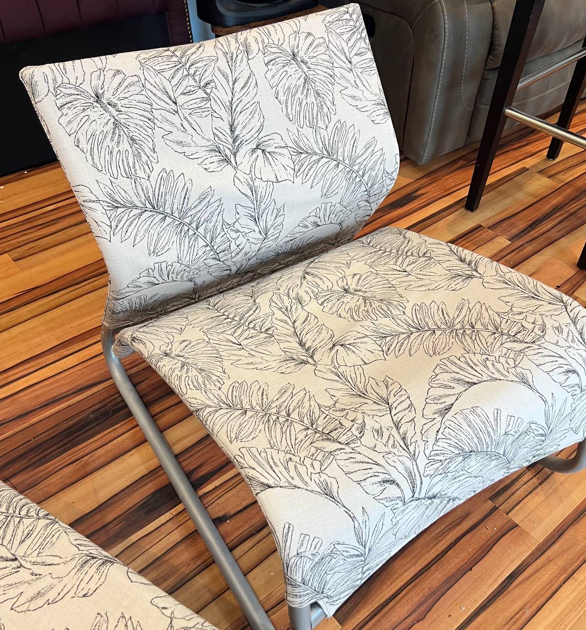 white patio lounge chair with leaf pattern