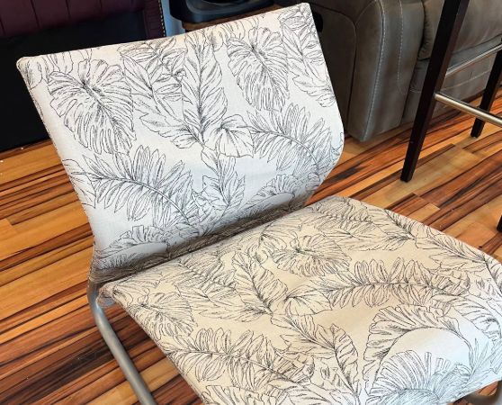 white patio lounge chair with leaf pattern