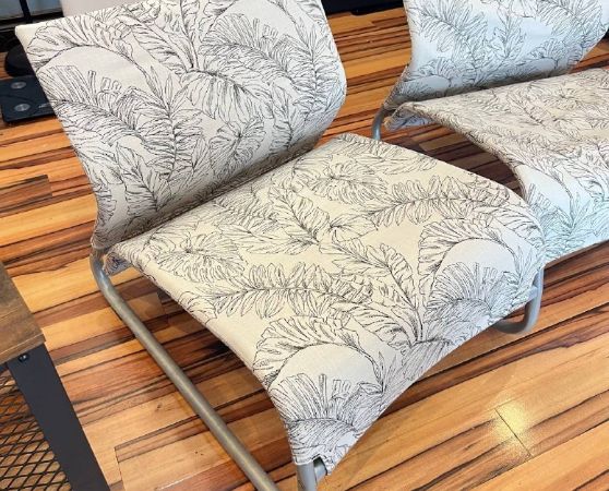2 patio lounge chairs with floral pattern