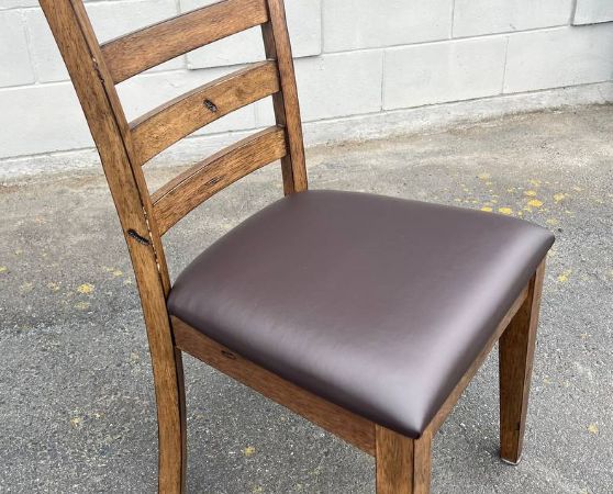 Brown wooden ladder-back chair