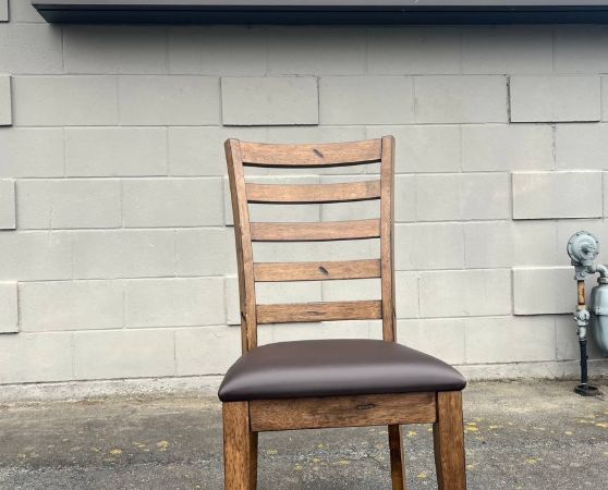 Brown wooden ladder-back chair