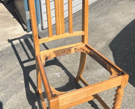 Frame of a wooden dining chair without the seat cushion