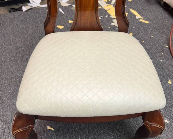 Wooden dining chair with cream tufted cushion and cabriole legs