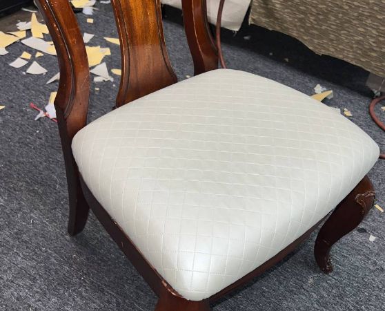 Wooden dining chair with cream tufted cushion and cabriole legs