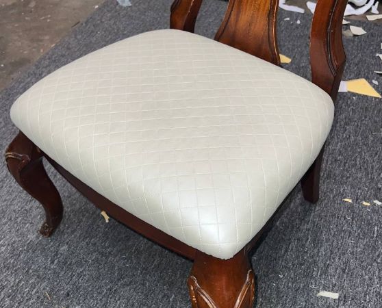 Wooden dining chair with cream tufted cushion and cabriole legs