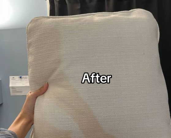 Sofa cushion reupholstered in a clean, modern off-white fabric.