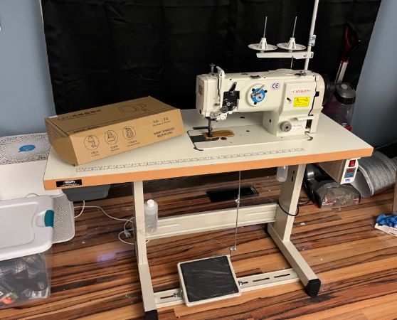 An off-white sewing machine in a workplace