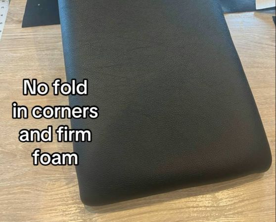 Black upholstered center console armrest