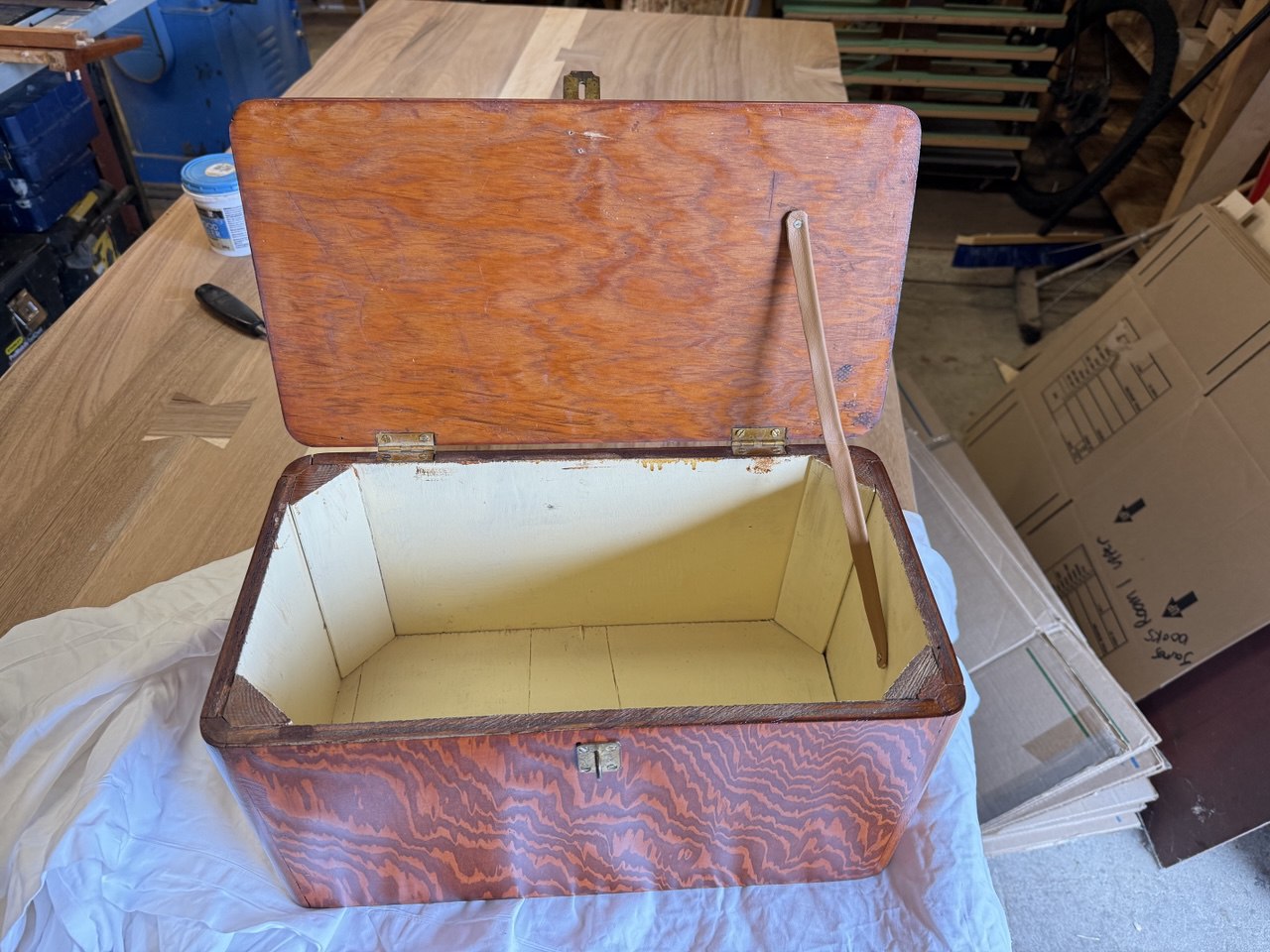 Refinished vintage wooden chest with reddish-brown finish and metal clasp
