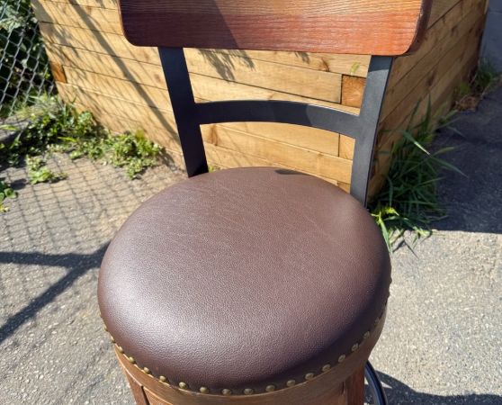 Bar stool reupholstered in chocolate brown vinyl with a new cushion