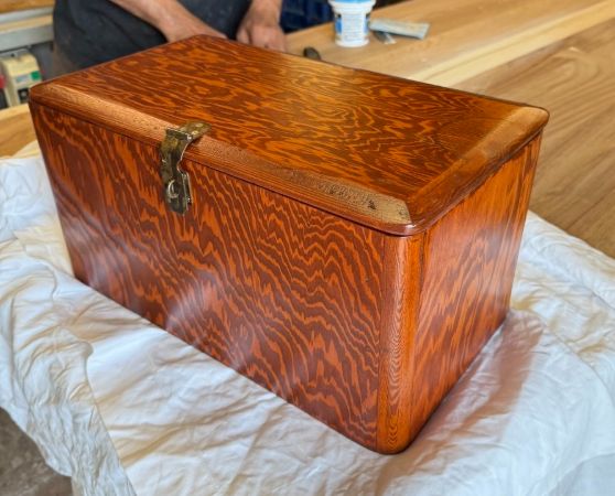 Refinished vintage wooden chest with reddish-brown finish and metal clasp