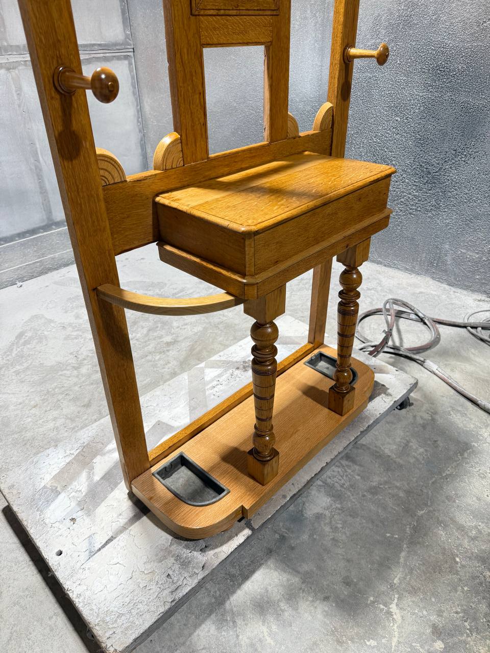 Refinished wooden coat rack with multiple hooks