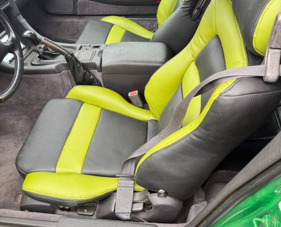 Black and green custom upholstered car seats.