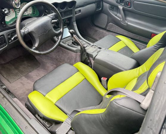 Black and green custom upholstered car seats.