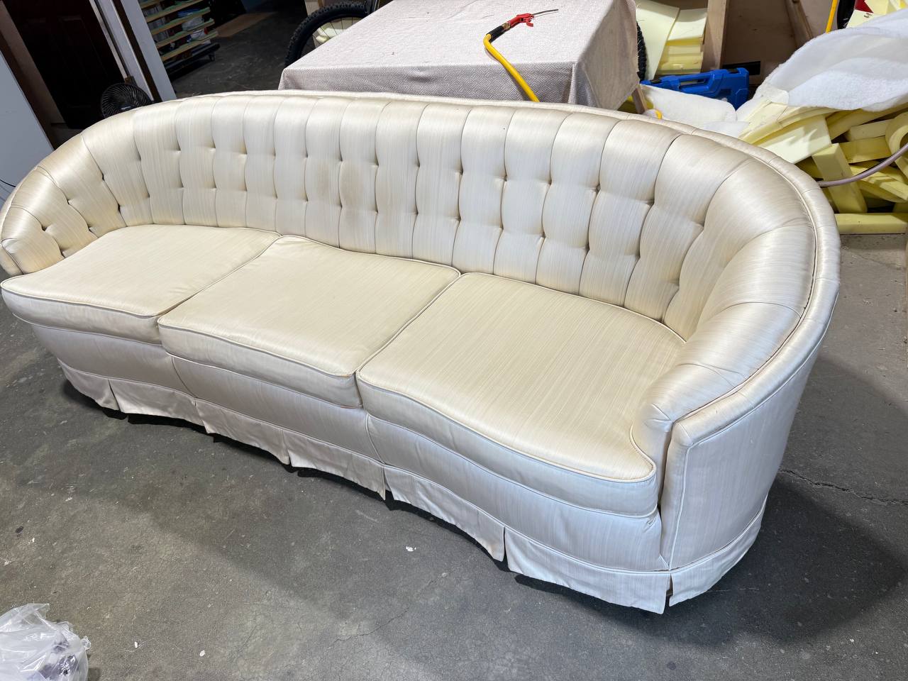 Tufted Chesterfield sofa in white fabric with rolled arms and curved frame