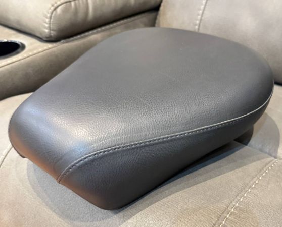 Gray leather motorcycle seat, contoured design.