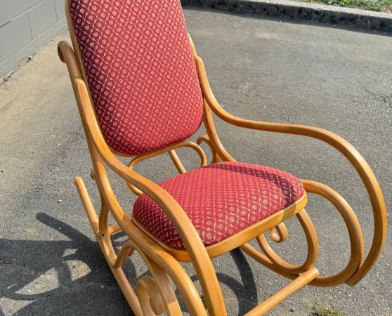 Elegant bentwood rocking chair with a red patterned upholstered seat and back
