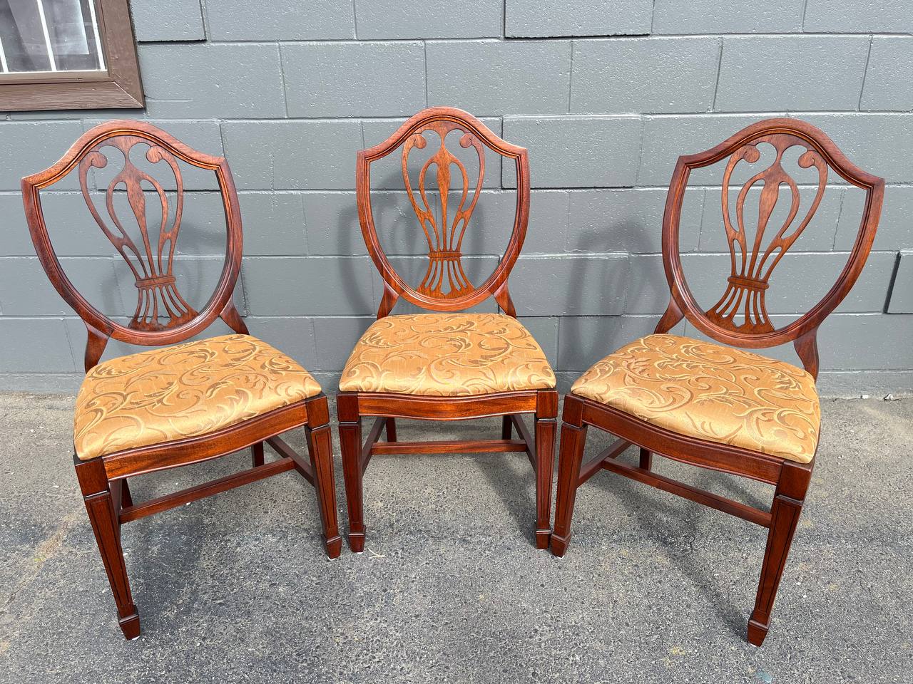 Refinished solid mahogany dining chair with dark brown stain and reupholstered.