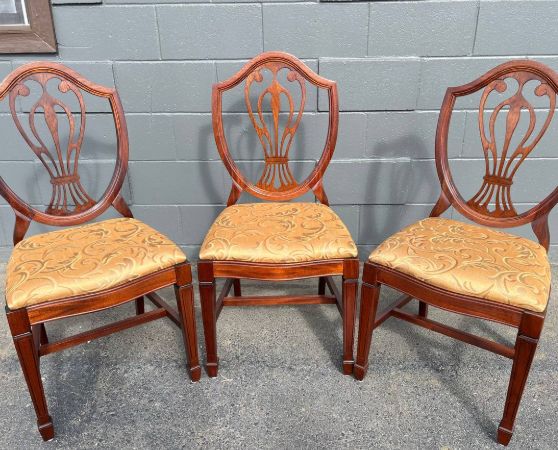 Refinished solid mahogany dining chair with dark brown stain and reupholstered.