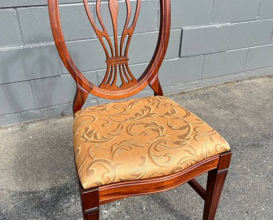 Refinished solid mahogany dining chair with dark brown stain and reupholstered.