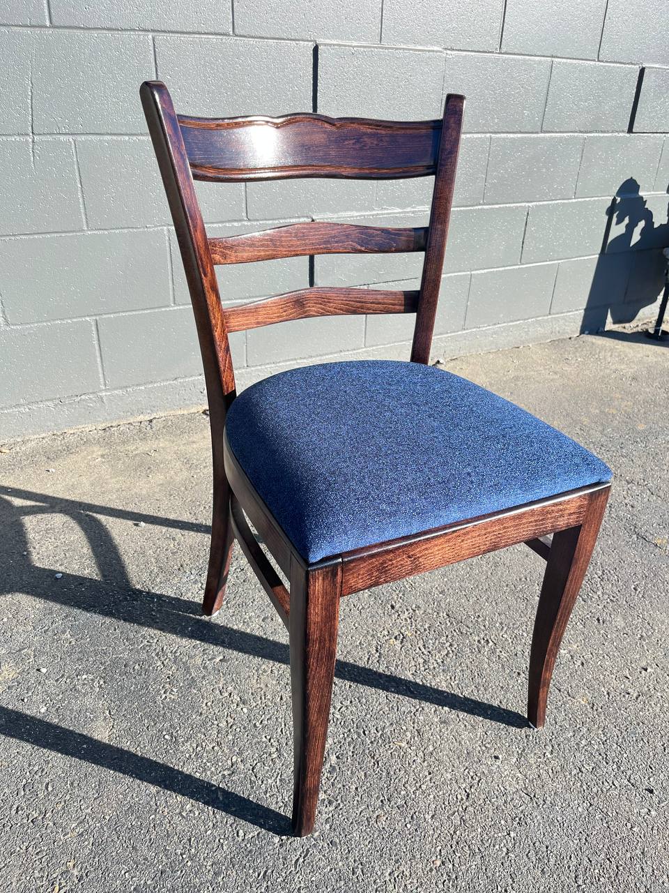 Refinished and reupholstered dining chair in brown stain in a royal blue fabric