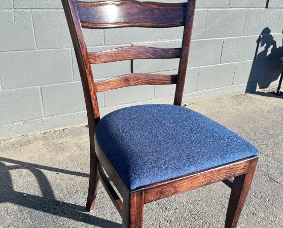 Refinished and reupholstered dining chair in brown stain in a royal blue fabric