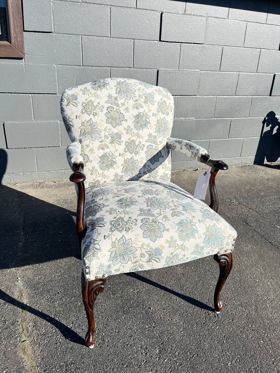 Reupholstered antique chair in white floral pattern