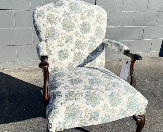 Reupholstered antique chair in white floral pattern