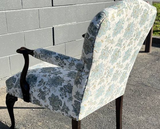 Back of the reupholstered antique chair in white floral pattern