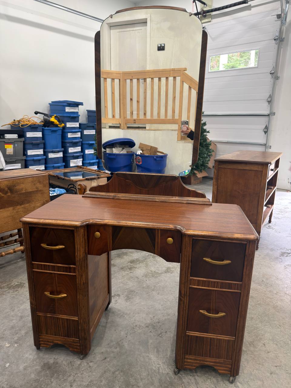 Front of Refinished Waterfall-style Vanity with Mirror and Brass Hardware