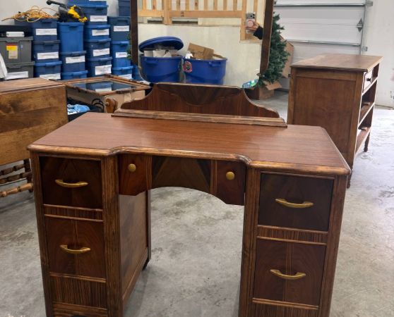 Front of Refinished Waterfall-style Vanity with Mirror and Brass Hardware
