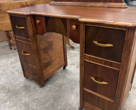 Front of Refinished Waterfall-style Vanity with Mirror and Brass Hardware