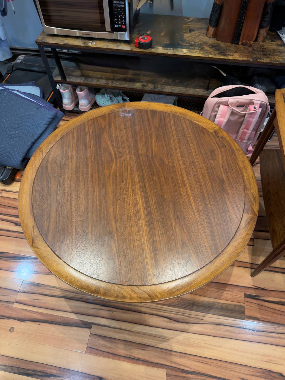 Top of Refinished Mid-century Modern Round Walnut Coffee Table stained in Dark Walnut danish oil