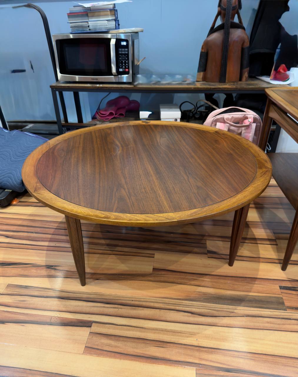 Side of Refinished Mid-century Modern Round Walnut Coffee Table stained in Dark Walnut danish oil