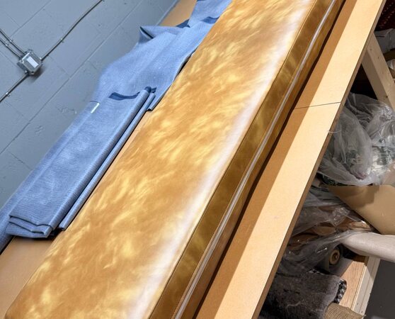 Long golden marbled vinyl bench cushion